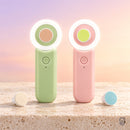 Lumio verde e rosa com a luz acesa, em fundo de céu ao amanhecer